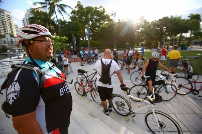 fl-clo-ride-of-silenceTed Rivera (left) looks on as cyclists gather at Esplanade Park in Fort Lauderdale during the Ride of Silence on May 21, 2014. The ceremony is a part of an annual event where cyclists take to the roads in a silent procession to hono
